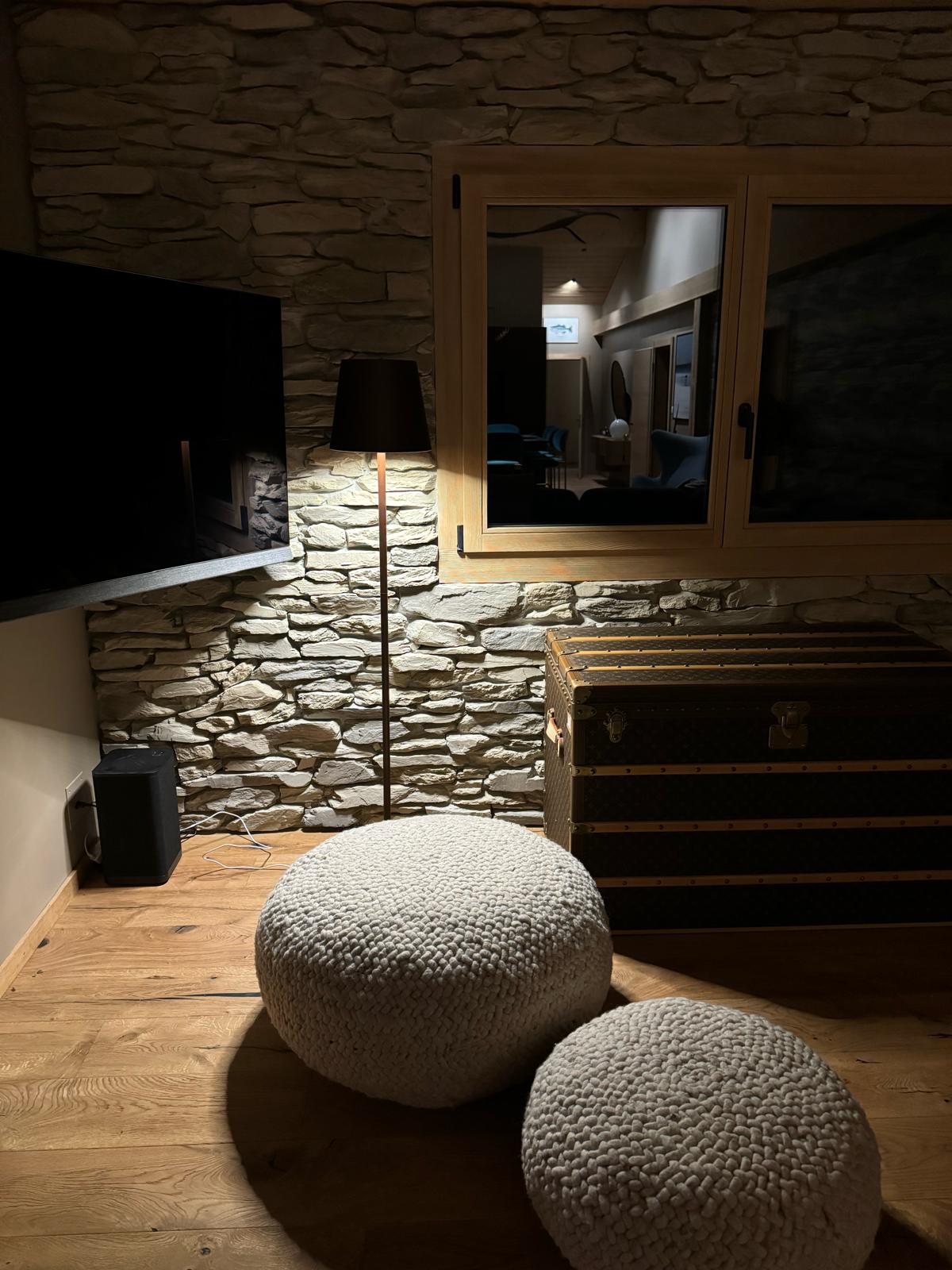 Private chalet living room with stone and natural textures